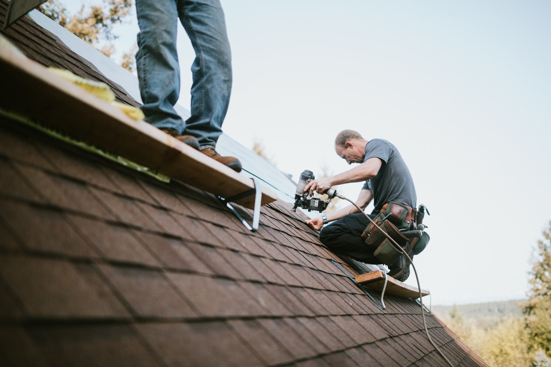 A GeoBrix contractor at work on a roof